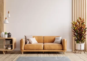comodo sofa con cuscini, in background una parete grigia, l'immagine è renderizzata 3d